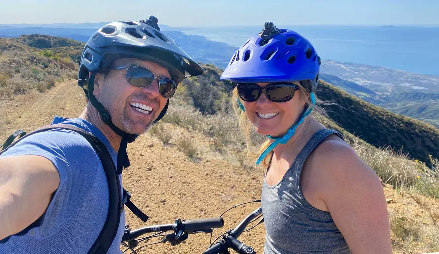 photo of Rob and Nancy biking